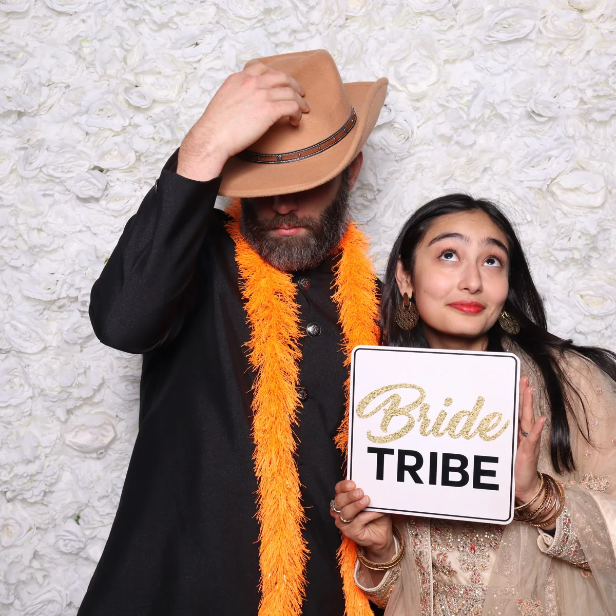 Clutch City luxury photo booth with floral wall backdrop at Houston event
